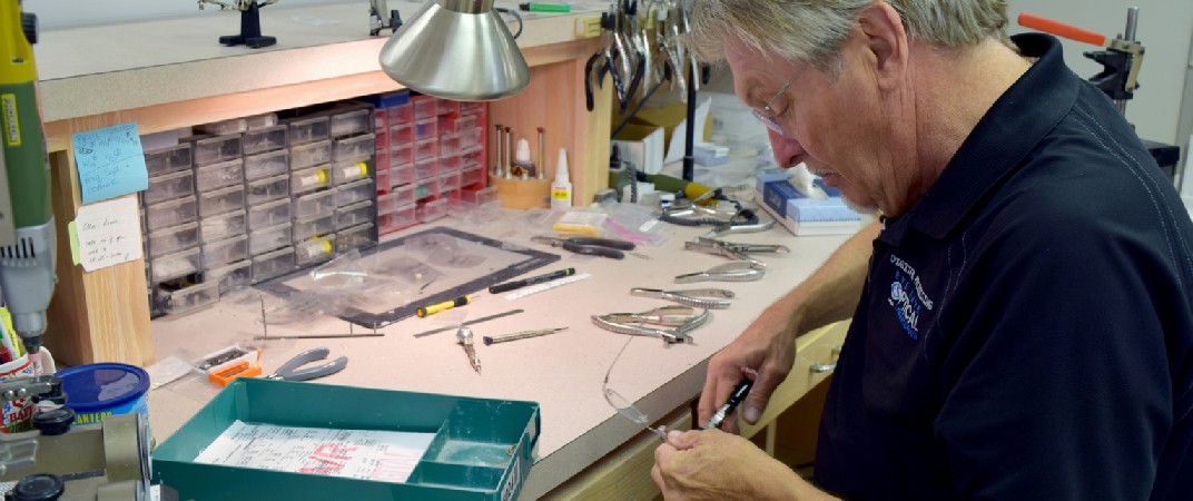 picture of lab tech adjusting frames